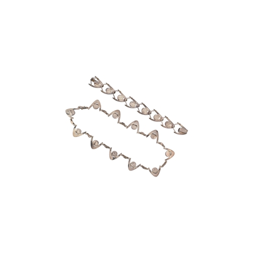 318 - Arne Johansen - A 1970s Danish modernist 925 sterling silver necklace and bracelet set. The necklace... 