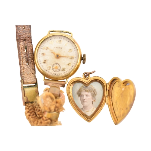 319 - A collection of jewellery and a wristwatch. To include a gold bead bracelet with simulated pearls an... 