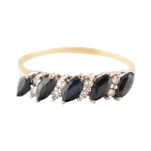 320 - A hallmarked 18ct gold sapphire and diamond five stone ring. Weight 2.6g. Size V