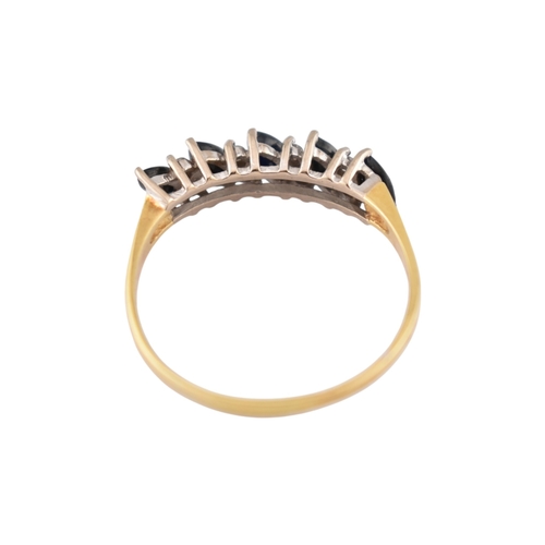 320 - A hallmarked 18ct gold sapphire and diamond five stone ring. Weight 2.6g. Size V