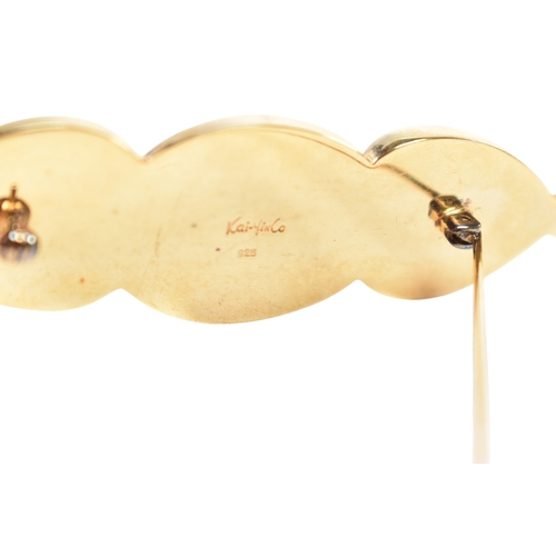 322 - A collection of Kai Yin Lo silver gilt and gem-set earrings and a brooch pin. Including a three ston... 