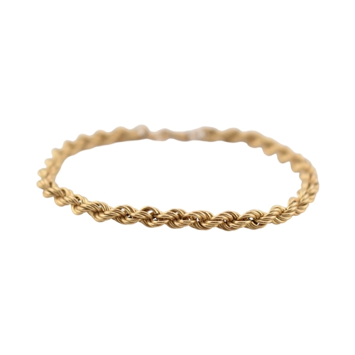 324 - A hallmarked 9ct gold rope twist necklace & a rope twist bracelet. The necklace with bi-colour d... 