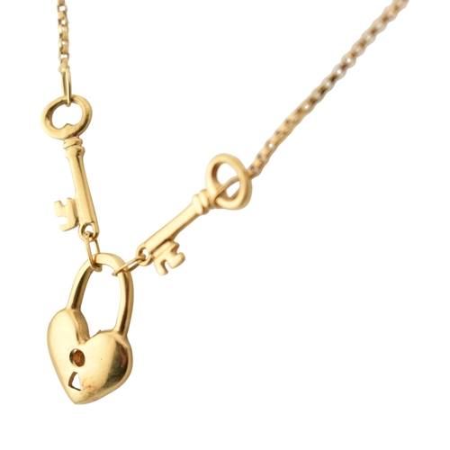 326 - An 18ct gold pendant necklace. The necklace with heart and key motif pendant. Italian assay marks *5... 