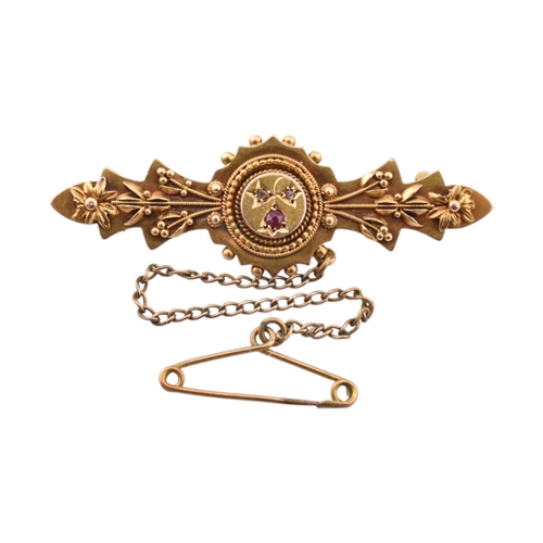 327 - A Victorian 15ct gold Ruby and diamond brooch pin with filigree decoration. Stamped 15ct. Pin metal.... 
