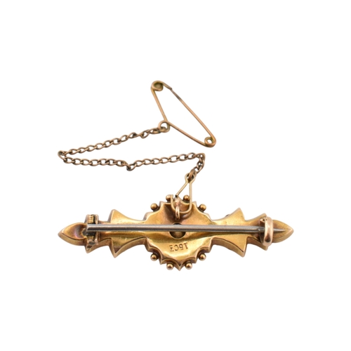 327 - A Victorian 15ct gold Ruby and diamond brooch pin with filigree decoration. Stamped 15ct. Pin metal.... 