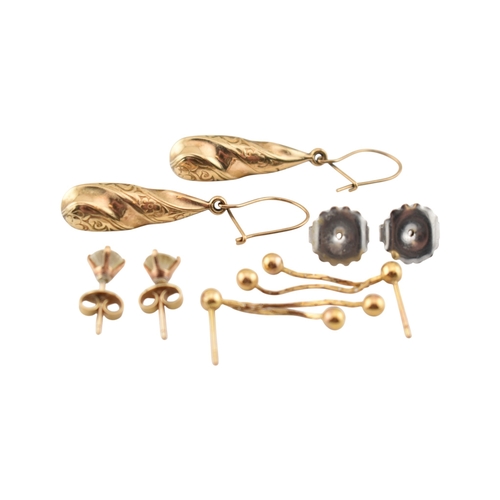 329 - Three pairs of yellow metal pendant earrings. Unmarked, tests indicate 9ct gold. Weight 3.5g.