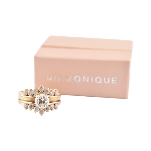 331 - A 14ct gold Diamonique CZ stacking ring. The ring in three parts all set with CZ. Stamped CZ DQ 14k.... 
