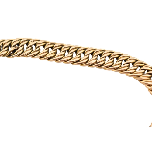 335 - A 15ct gold fancy link bracelet adorned with a 9ct gold hallmarked heart padlock. Stamped 15ct to br... 