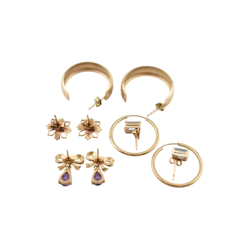 338 - A collection of 9ct gold and gem set earrings. The earrings to include hoops, amethyst, bow pendant ... 