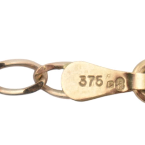 346 - A hallmarked 9ct gold locket pendant necklace. The locket plastic glazed with felt lining to interio... 