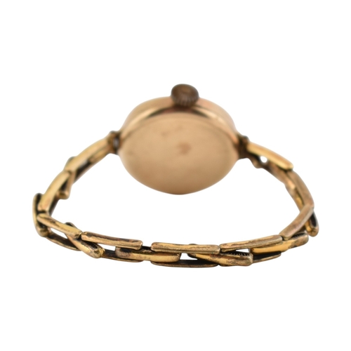 349 - An 1930s hallmarked 9ct gold watch on an expanding gold on silver strap. Hallmarked Chester 1932. AF... 