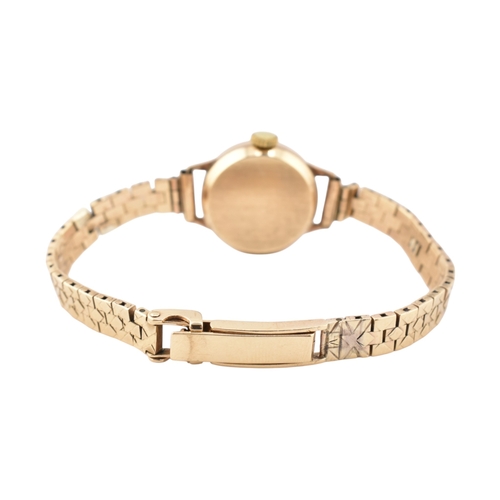 351 - A Certina 9ct gold watch. The watch with a champagne dial and dagger hands. Total weight 17.7g. Meas... 