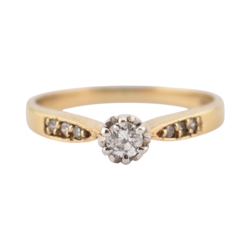352 - A hallmarked 9ct gold and diamond solitaire ring. The ring having diamond set shoulders. Weight 2.7g... 