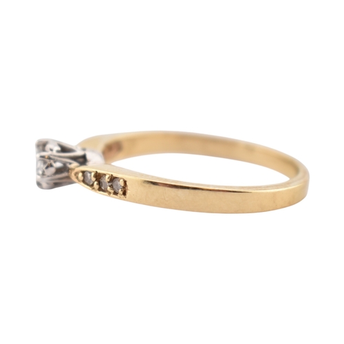 352 - A hallmarked 9ct gold and diamond solitaire ring. The ring having diamond set shoulders. Weight 2.7g... 