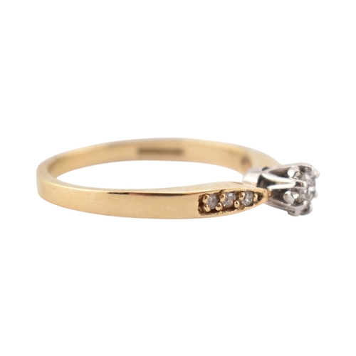 352 - A hallmarked 9ct gold and diamond solitaire ring. The ring having diamond set shoulders. Weight 2.7g... 