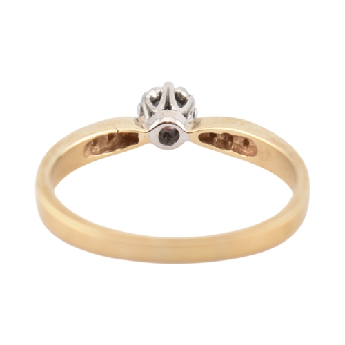 352 - A hallmarked 9ct gold and diamond solitaire ring. The ring having diamond set shoulders. Weight 2.7g... 