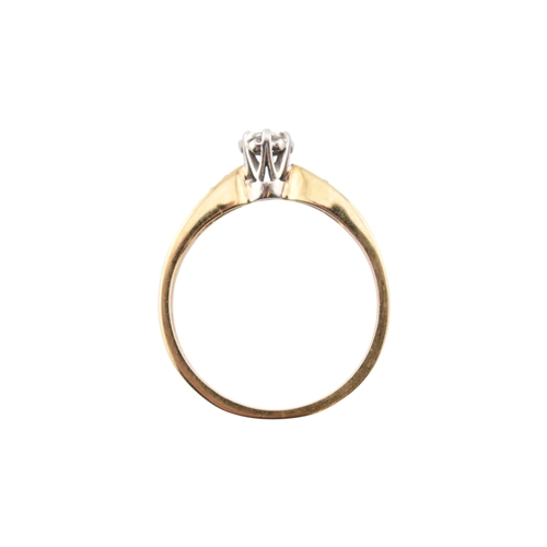 352 - A hallmarked 9ct gold and diamond solitaire ring. The ring having diamond set shoulders. Weight 2.7g... 