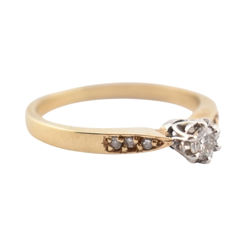 352 - A hallmarked 9ct gold and diamond solitaire ring. The ring having diamond set shoulders. Weight 2.7g... 