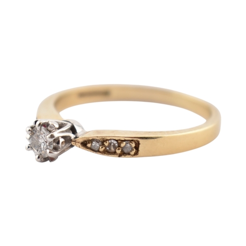 352 - A hallmarked 9ct gold and diamond solitaire ring. The ring having diamond set shoulders. Weight 2.7g... 