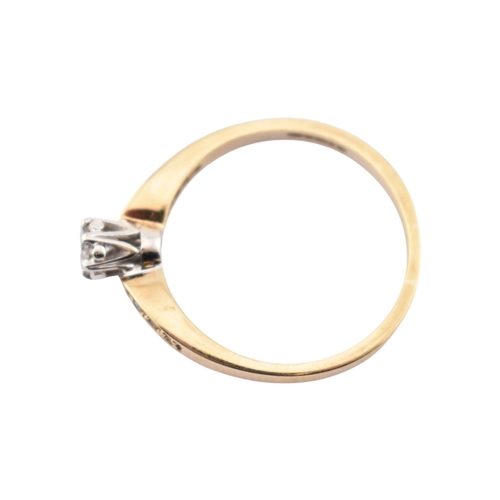 352 - A hallmarked 9ct gold and diamond solitaire ring. The ring having diamond set shoulders. Weight 2.7g... 