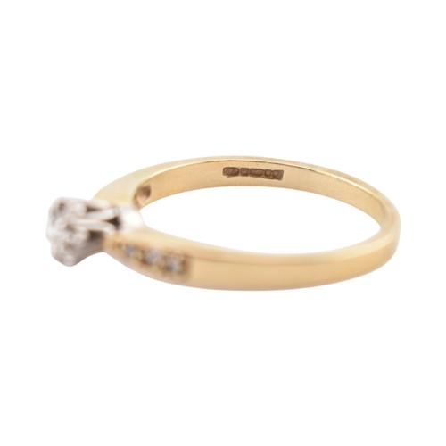 352 - A hallmarked 9ct gold and diamond solitaire ring. The ring having diamond set shoulders. Weight 2.7g... 