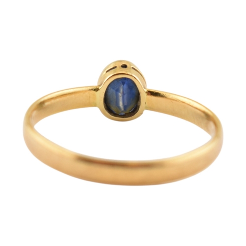353 - A hallmarked 22ct gold and sapphire ring. Weight 2.3g. Size P. 