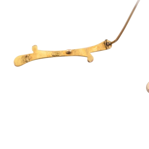 356 - A 9ct gold bar brooch pin together with two other brooch pins one stamped 9ct another unmarked with ... 