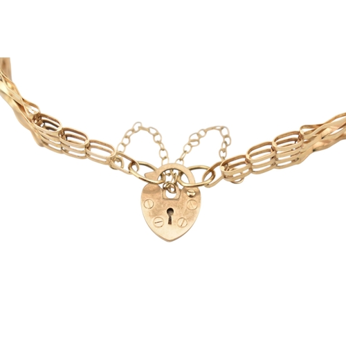 357 - A hallmarked 9ct gold gate link bracelet with heart padlock clasp. Weight 5.8g. Measures 20cm