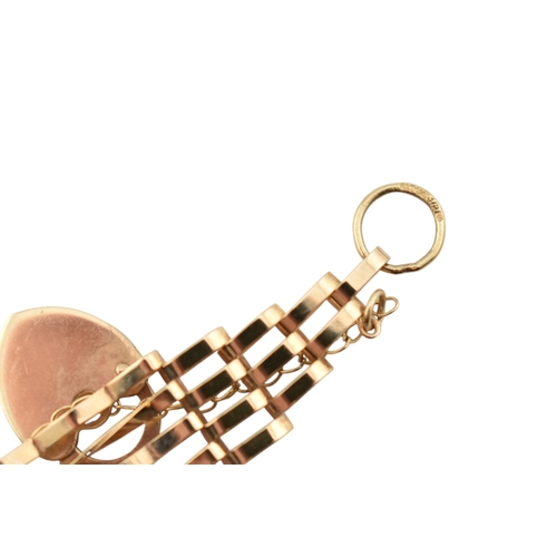 357 - A hallmarked 9ct gold gate link bracelet with heart padlock clasp. Weight 5.8g. Measures 20cm