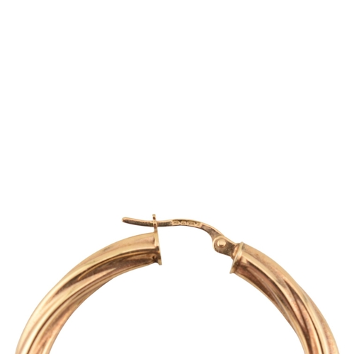 363 - A collection of 9ct gold earrings to include creole hoop earrings, bi-colour and twisted examples. A... 