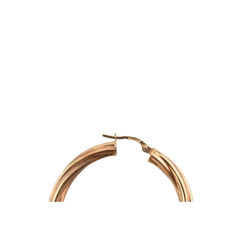 363 - A collection of 9ct gold earrings to include creole hoop earrings, bi-colour and twisted examples. A... 