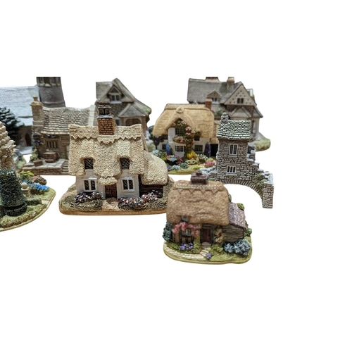 338 - Lilliput Lane - A collection of vintage 20th century resin cottage house figures. Including St Steph... 