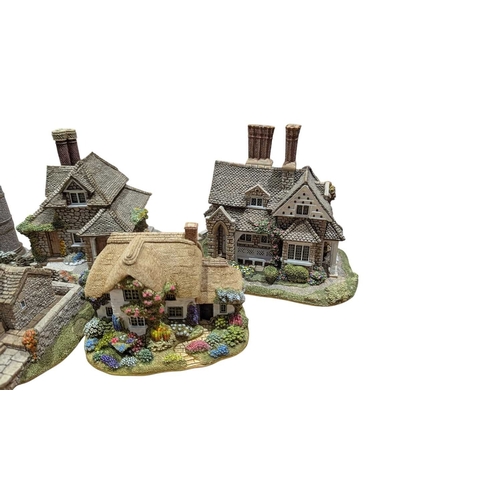 338 - Lilliput Lane - A collection of vintage 20th century resin cottage house figures. Including St Steph... 