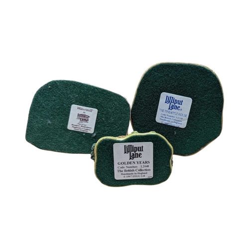 338 - Lilliput Lane - A collection of vintage 20th century resin cottage house figures. Including St Steph... 