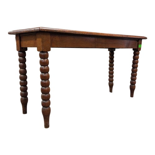 916 - A 19th century carved oak coffee table. Having a carved border with central field featuring foliate ... 
