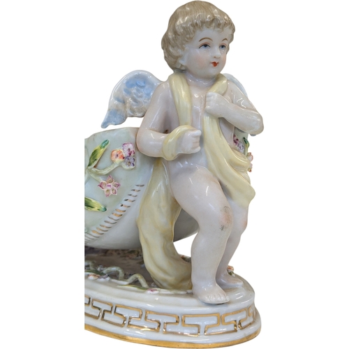 100 - A 20th century German Dresden style porcelain centre piece having figural putti to each side with fl... 