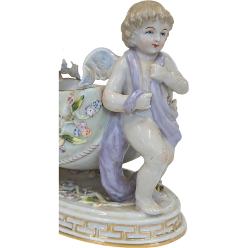 100 - A 20th century German Dresden style porcelain centre piece having figural putti to each side with fl... 