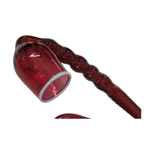 114 - A collection of four 19th century Victorian glass Nailsea pipes. Cranberry glass with white rims on ... 