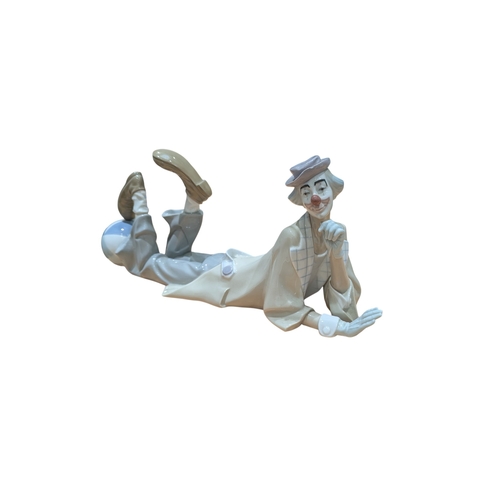 74 - Lladro - A vintage 20th century Lladro Spanish porcelain clown figure. Model no. 4618, Lying Clown (... 