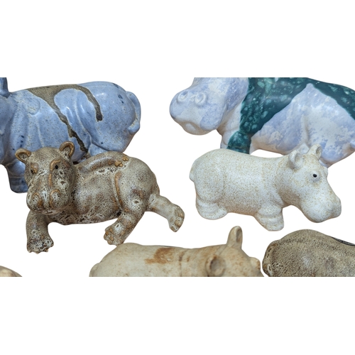 82 - John Bourdeaux Pottery - Eight contemporary ceramic Hippo sculptures. Comprising of two larger hippo... 