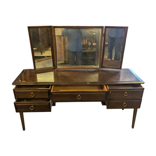 614 - Stag Furniture - Minstrel Range - vintage 20th century mahogany dressing table. Having knee hole cen... 