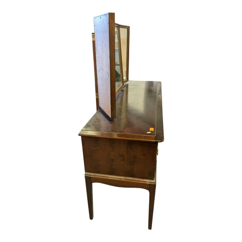 614 - Stag Furniture - Minstrel Range - vintage 20th century mahogany dressing table. Having knee hole cen... 