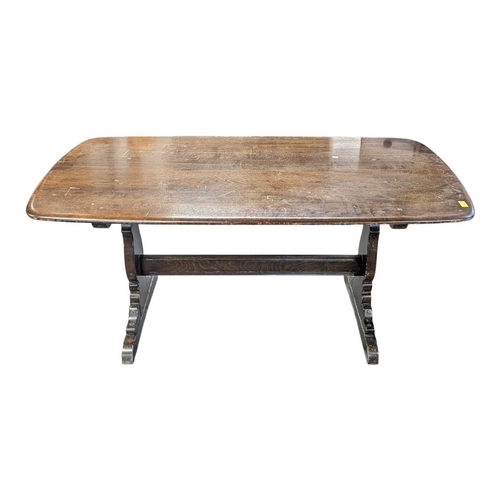 618 - Ercol Furniture, High Wycombe - A vintage 20th century golden dawn elm dining table. Large plank rec... 