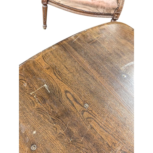 618 - Ercol Furniture, High Wycombe - A vintage 20th century golden dawn elm dining table. Large plank rec... 