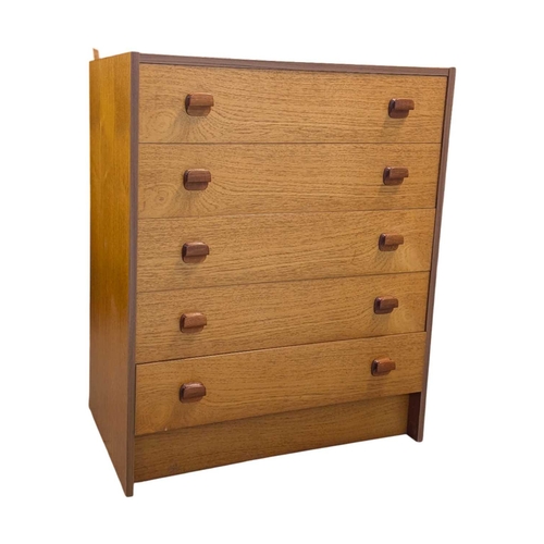 620 - Danish Modern Design - Late 20th century teak veneer chest of drawers. Having a bank of five drawers... 
