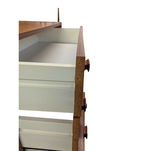 620 - Danish Modern Design - Late 20th century teak veneer chest of drawers. Having a bank of five drawers... 