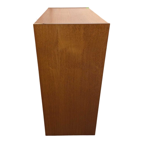 620 - Danish Modern Design - Late 20th century teak veneer chest of drawers. Having a bank of five drawers... 