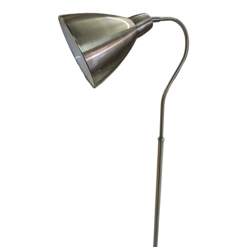622 - Two contemporary floor standing metal lamps. In a gilt colourway with curved arm terminating in coni... 