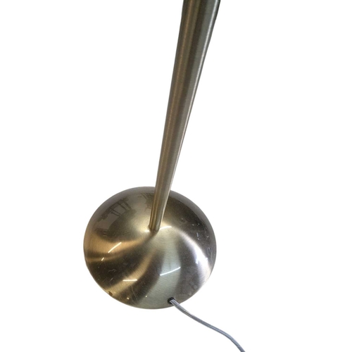 622 - Two contemporary floor standing metal lamps. In a gilt colourway with curved arm terminating in coni... 