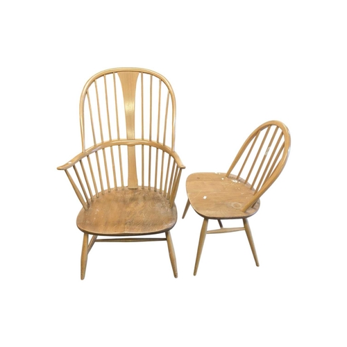 626 - Ercol Furniture - A 20th century Ercol comb-back double bow ' Chairmakers ' Windsor armchair. Of bee... 
